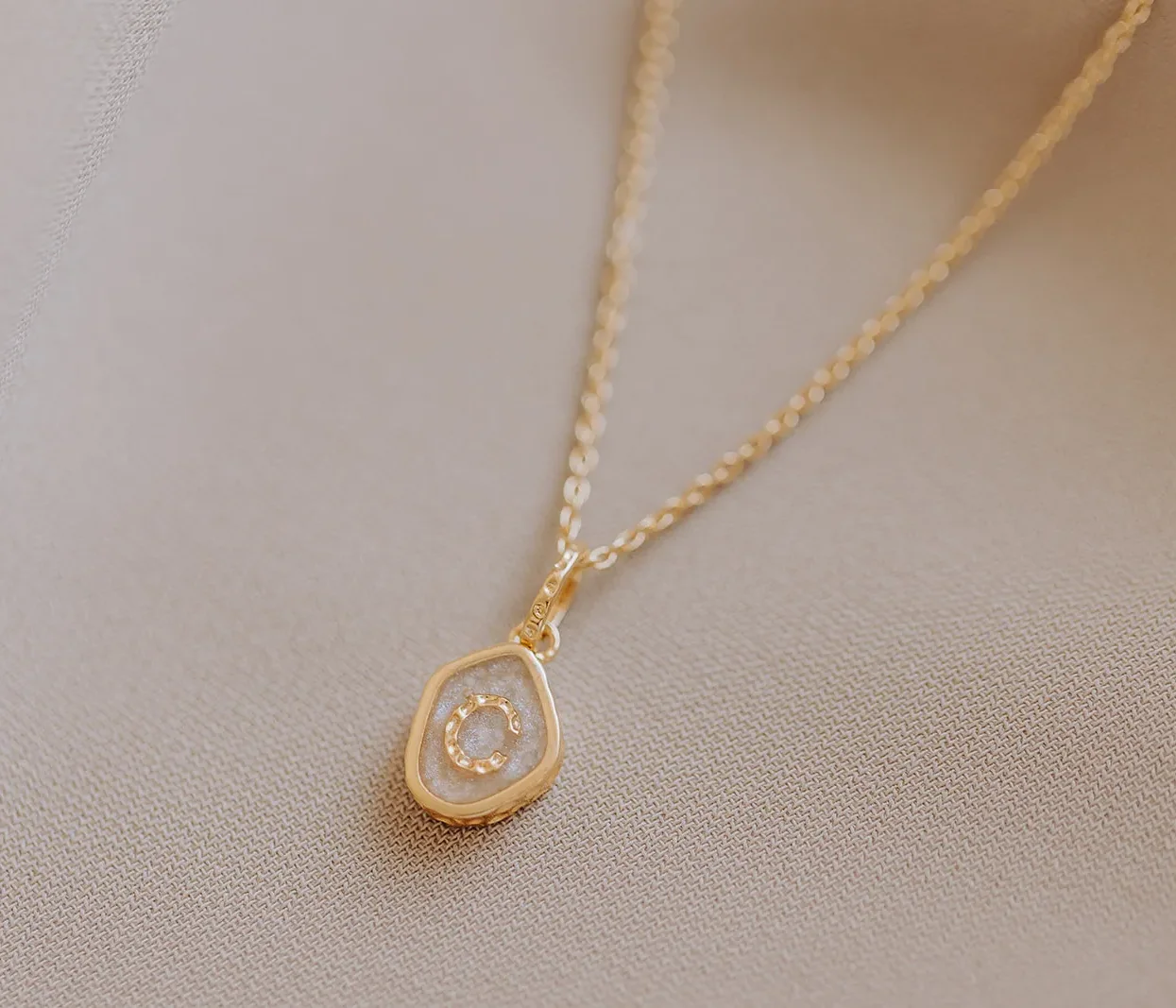 Memento ashanger/assieraad met initiaal